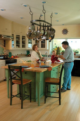 Monika and David Eichler and their daughter, Lauren, enjoy the kitchen’s maple island and often eat meals there rather than in the dining room.